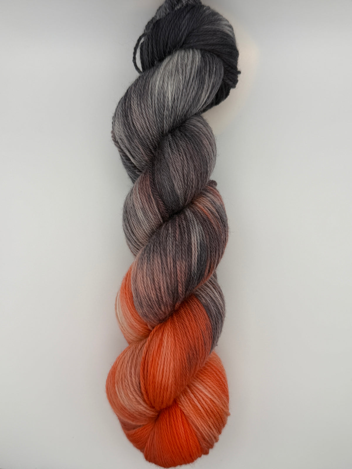 Hand dyed yarn uk, yarn dyed in small batches, Ashes & Embers available in Aran, DK 4 ply, sock, double knit, red, orange, grey tones.