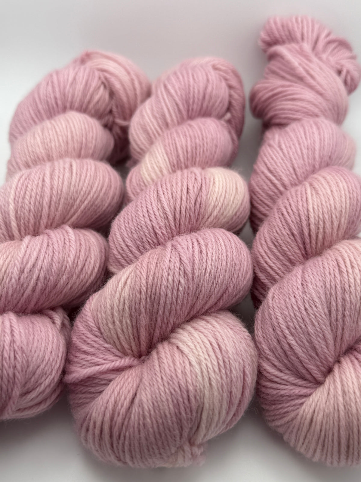 Hand dyed yarn uk, yarn dyed in small batches, Blossom available in Aran, DK 4 ply, sock, double knit, pink tones.