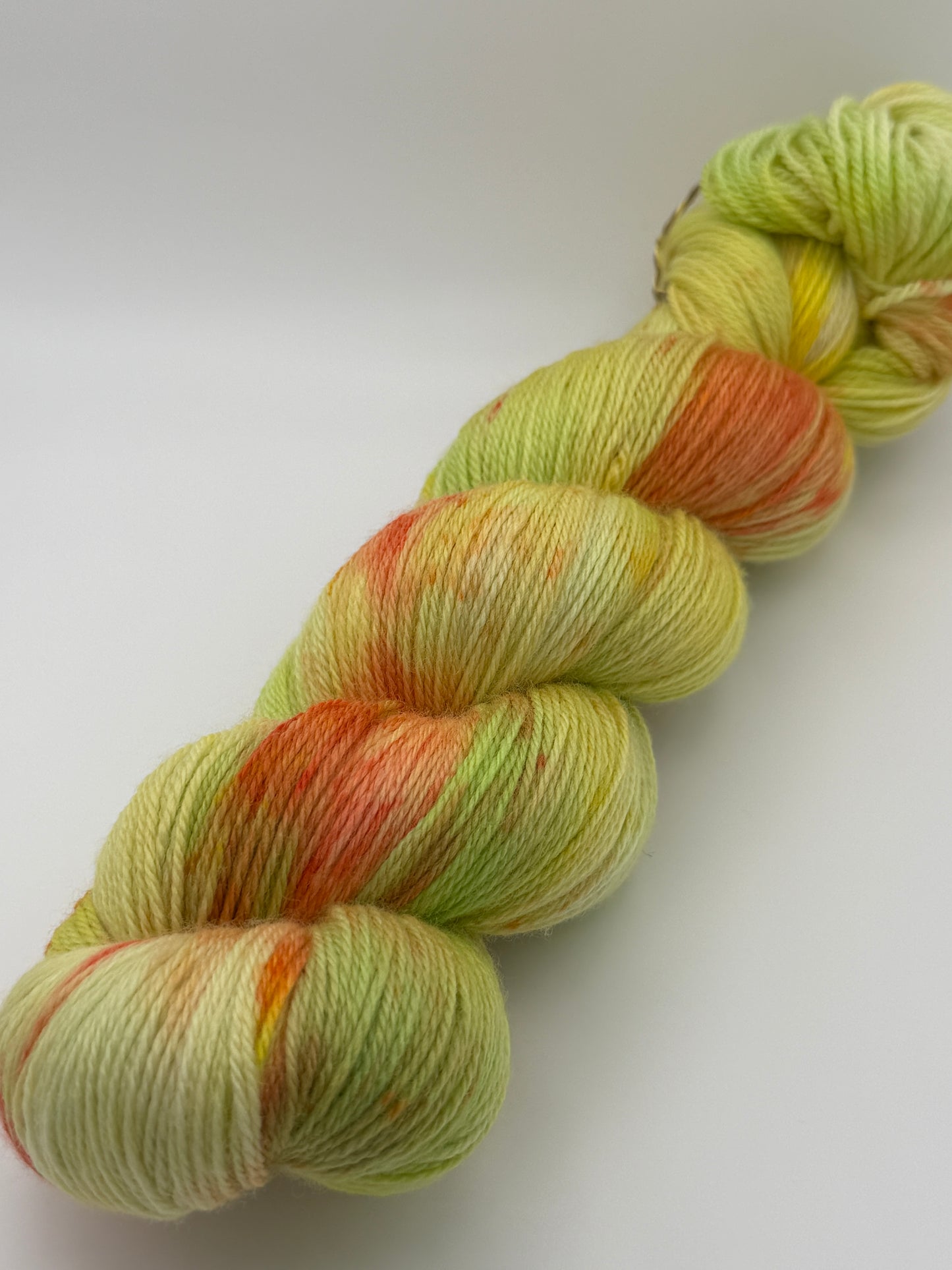 Hand dyed yarn in the UK dyed in small batches. Citrus Salad. Lemon, lime, orange, grapefruit tones.