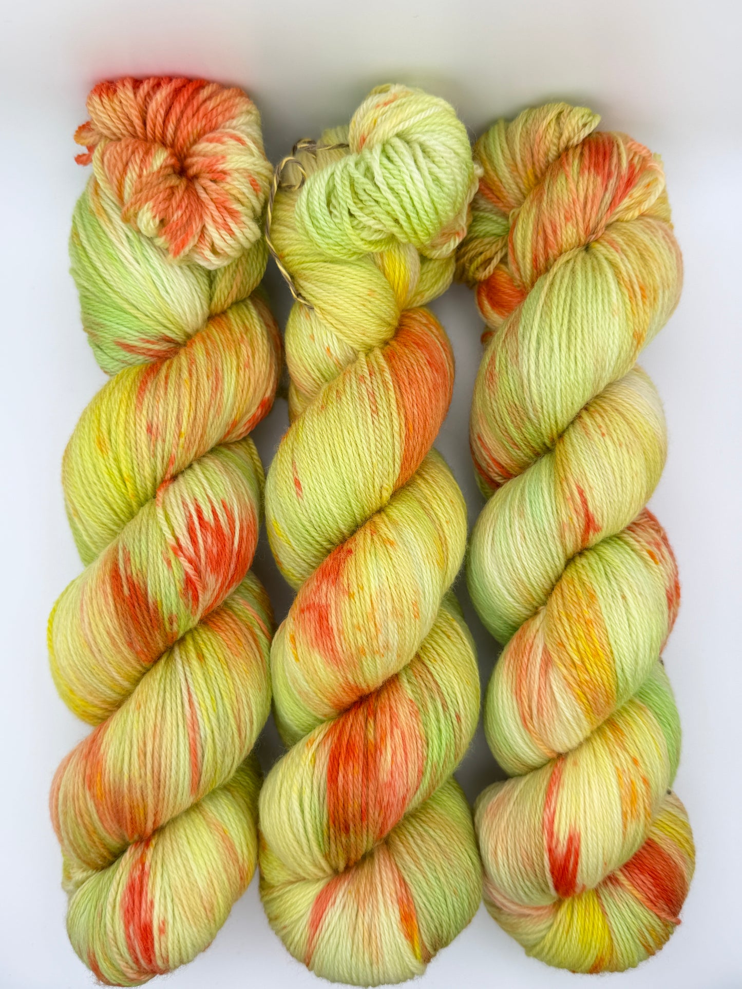 Hand dyed yarn in the UK dyed in small batches. Citrus Salad. Lemon, lime, orange, grapefruit tones.