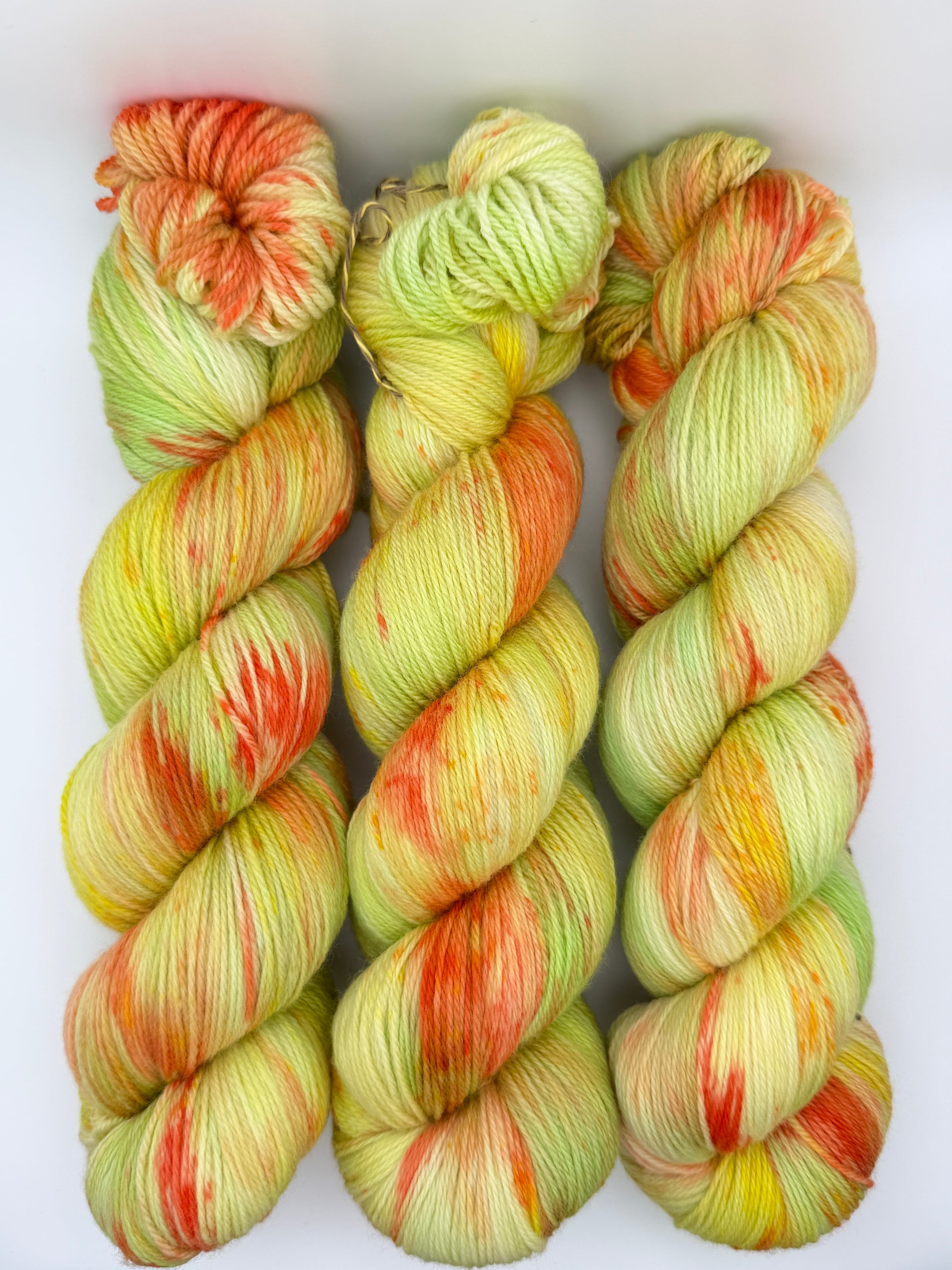 Hand dyed yarn in the UK dyed in small batches. Citrus Salad. Lemon, lime, orange, grapefruit tones.