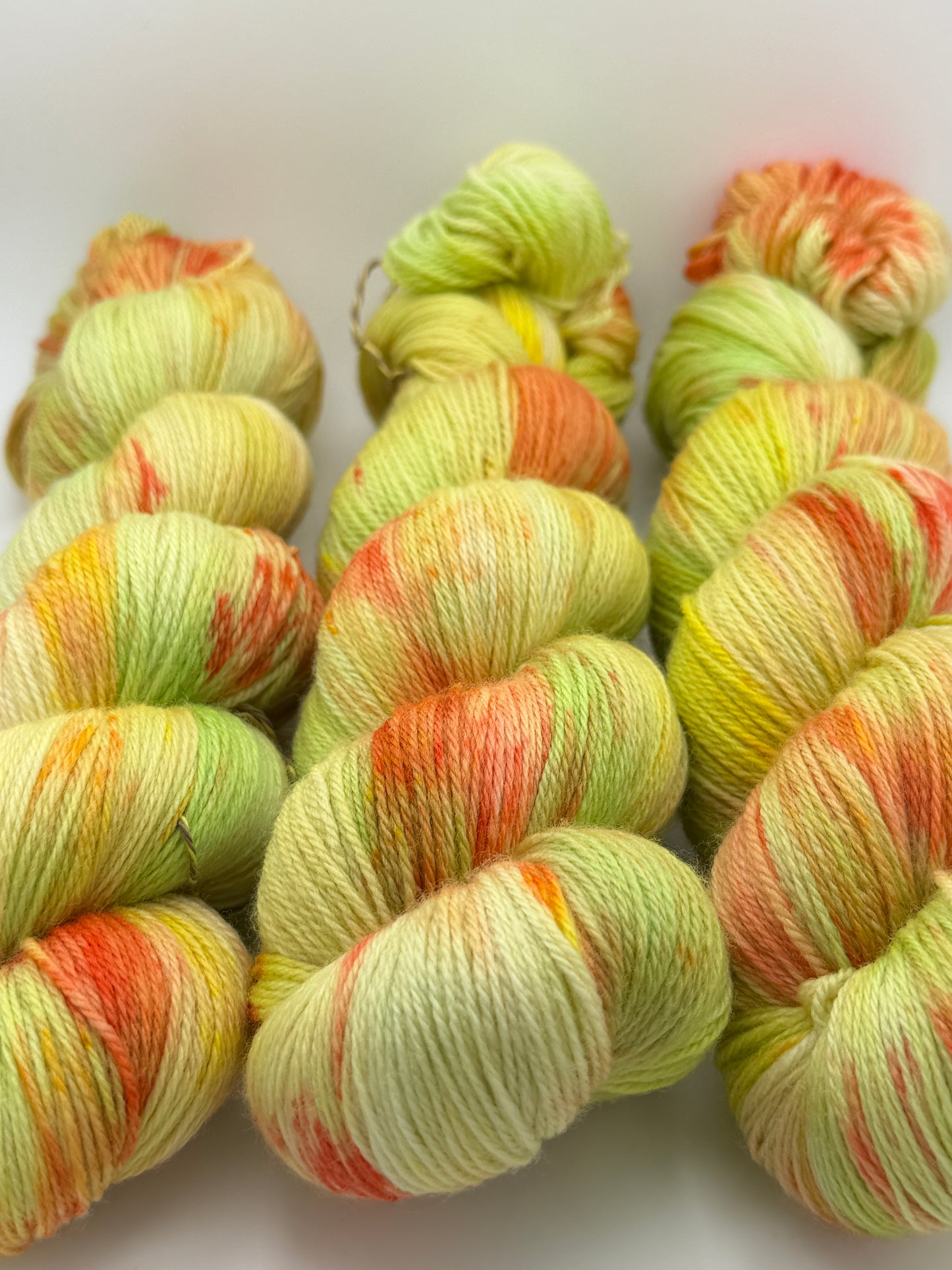 Hand dyed yarn in the UK dyed in small batches. Citrus Salad. Lemon, lime, orange, grapefruit tones.