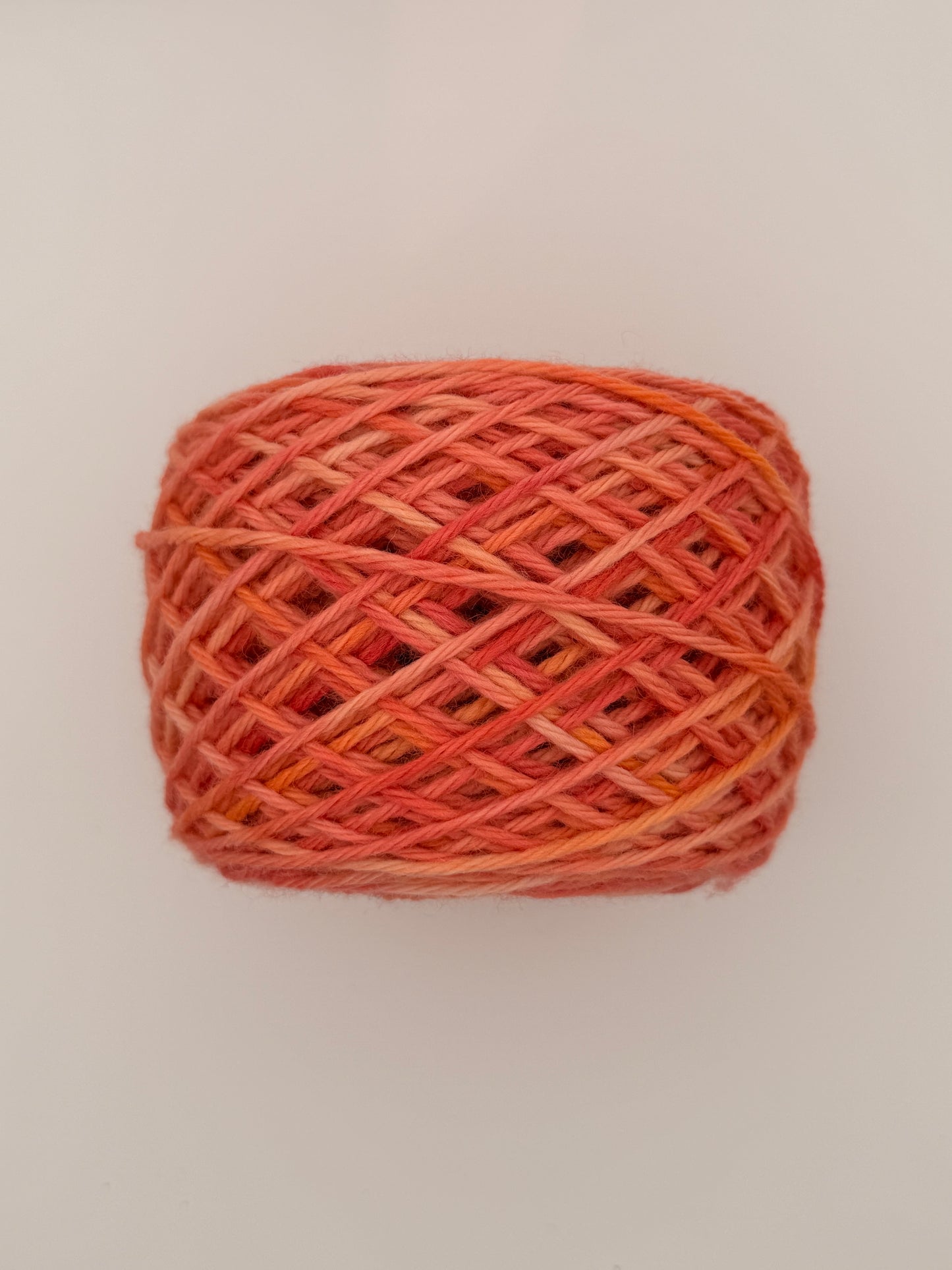 Hand dyed 4ply sock yarn available in DK, Aran, Sock, in Coral Crush colourway – Coral and Apricot tones