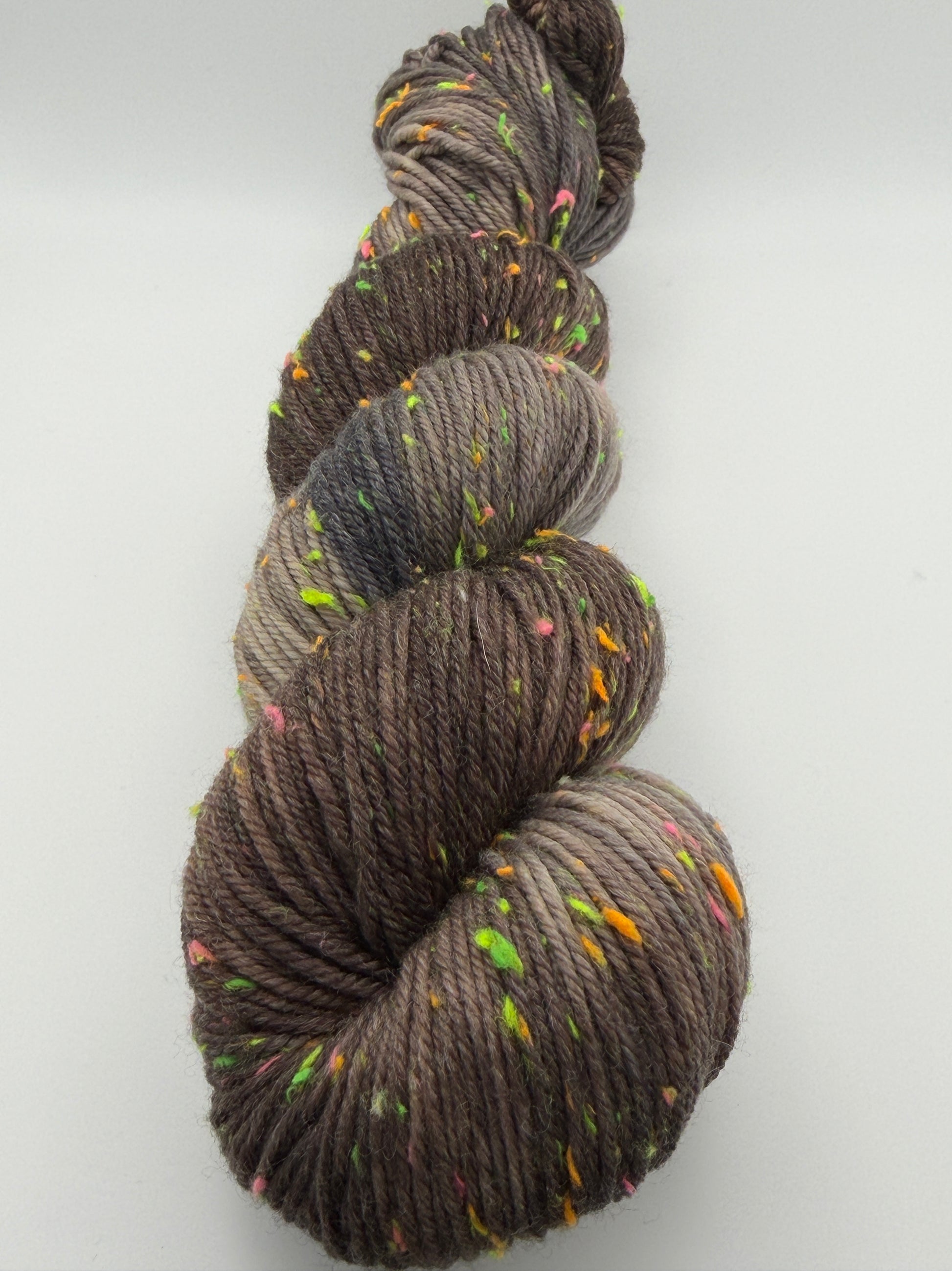 Hand dyed yarn in the UK dyed in small batches. Forest Floor, brown and grey tones with neo nep spekles.