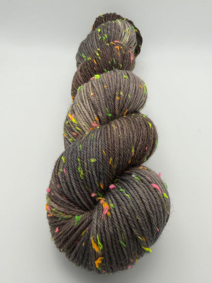 Hand dyed yarn in the UK dyed in small batches. Forest Floor, brown and grey tones with neo nep spekles.