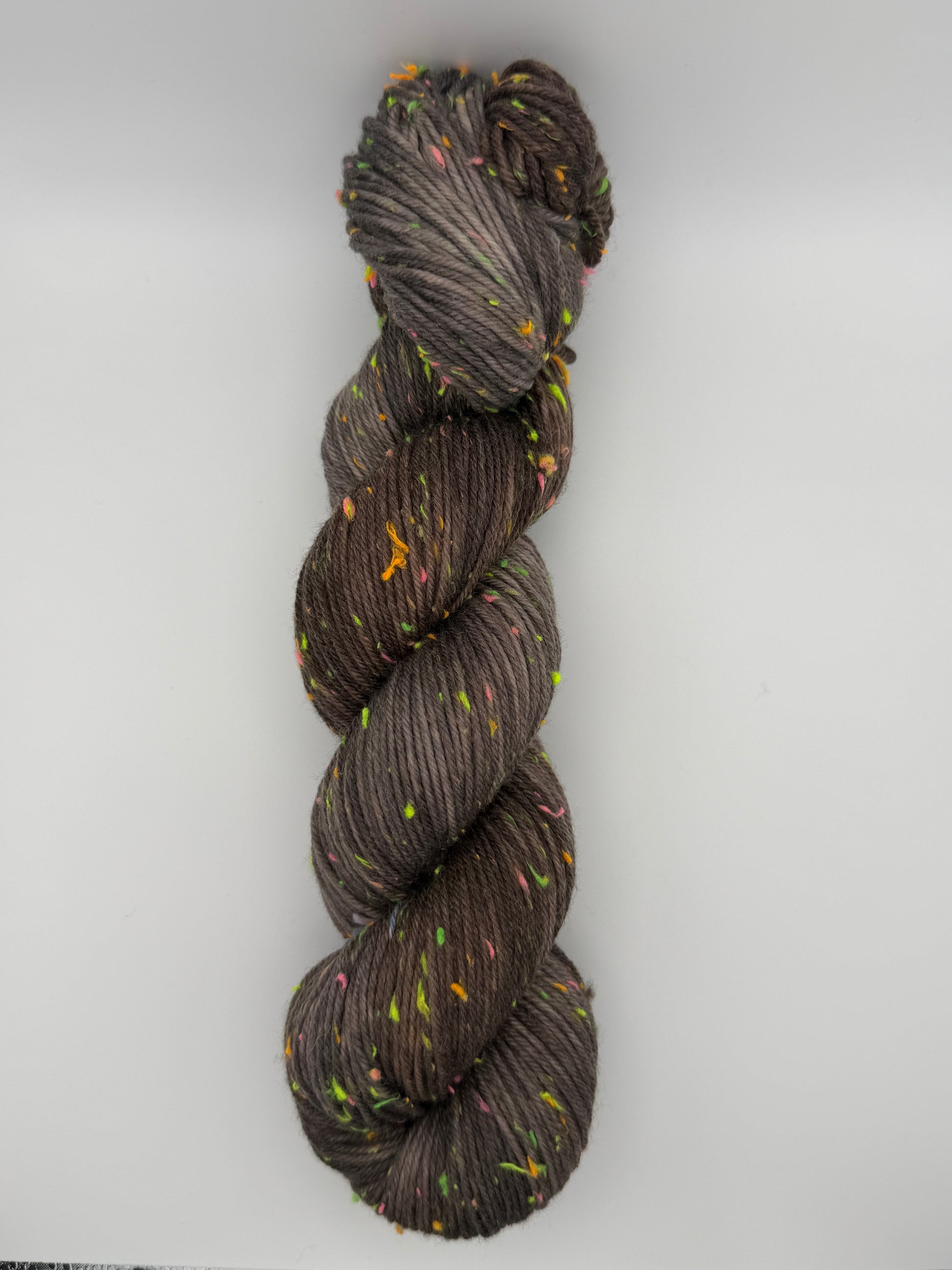 Hand dyed yarn in the UK dyed in small batches. Forest Floor, brown and grey tones with neo nep speckles.
