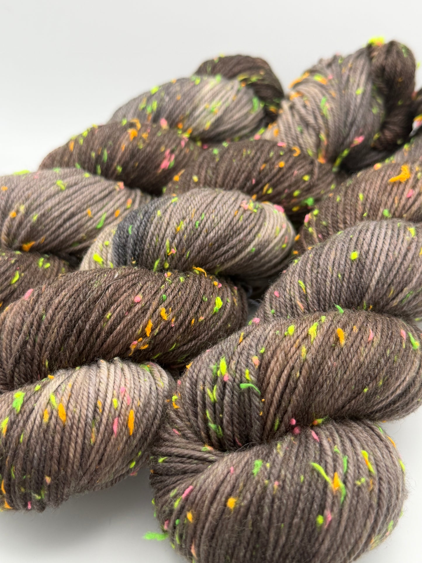 Hand dyed yarn in the UK dyed in small batches. Forest Floor, brown and grey tones with neo nep spekles.
