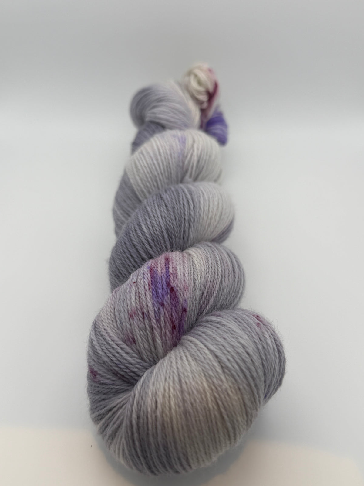 Hand dyed yarn uk, yarn dyed in small batches, geode available in Aran, DK 4 ply, sock, double knit, white, grey, purple tones.