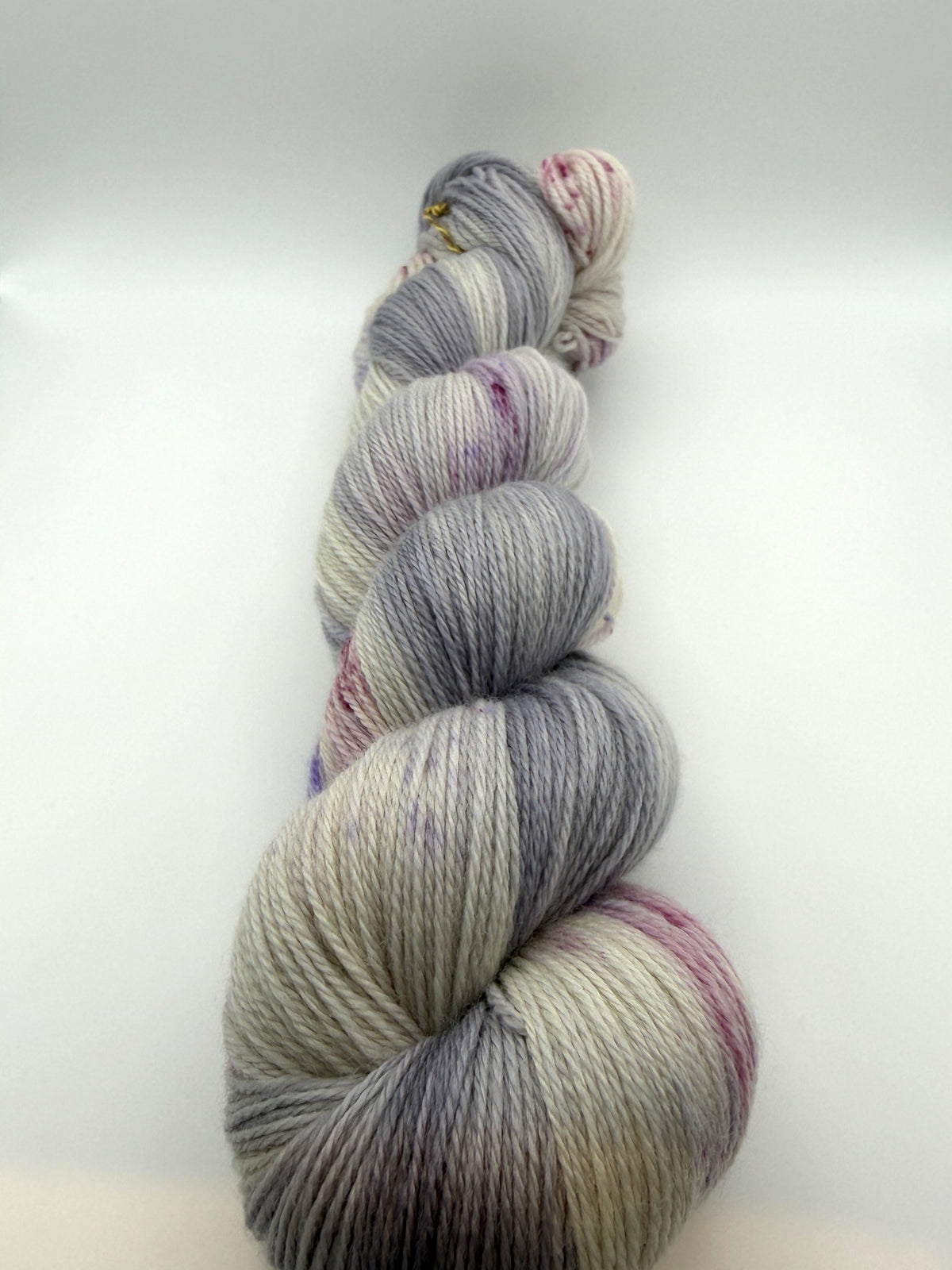 Hand dyed yarn uk, yarn dyed in small batches, geode available in Aran, DK 4 ply, sock, double knit, white, grey, purple tones.