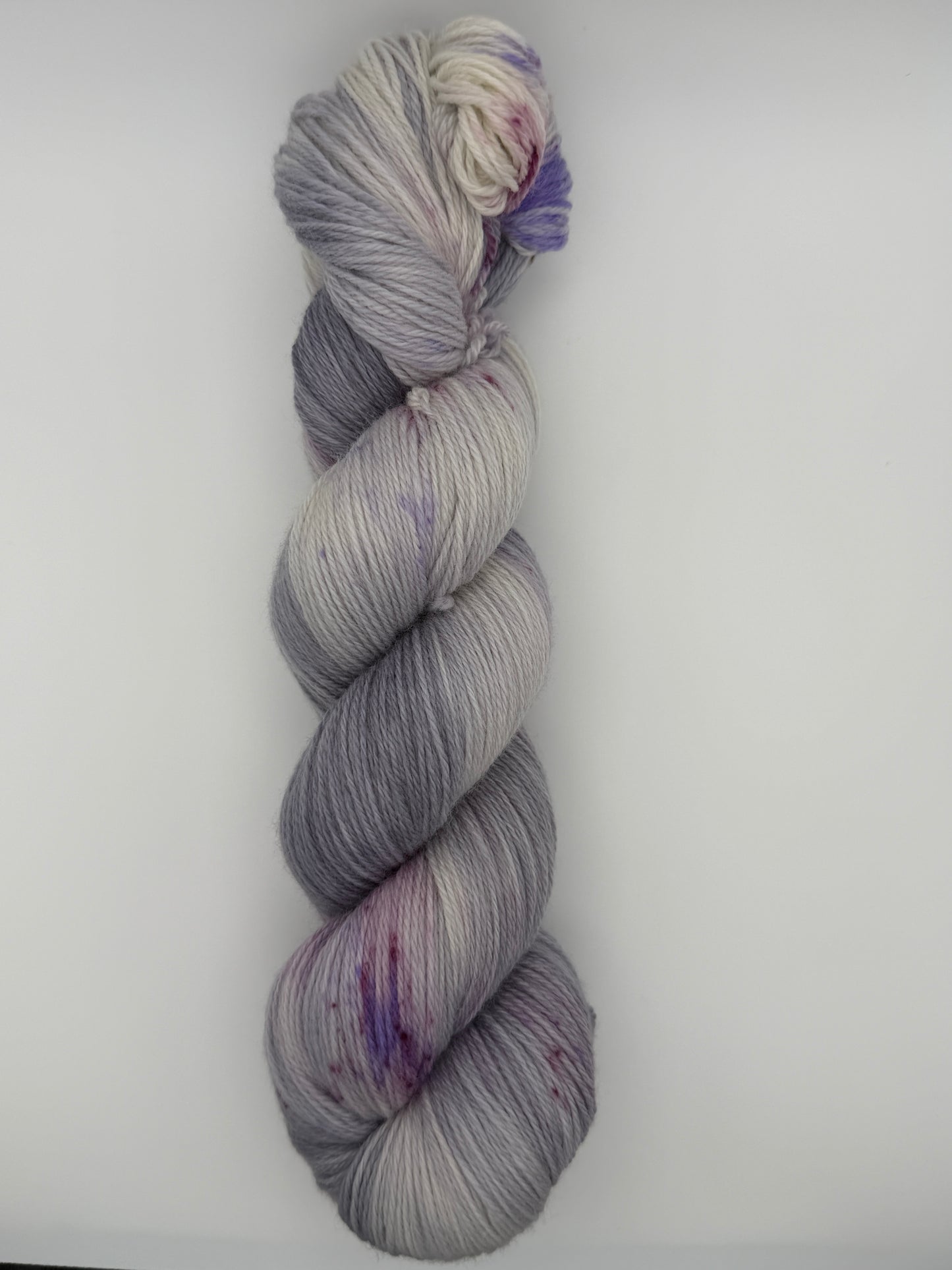Hand dyed yarn uk, yarn dyed in small batches, geode available in Aran, DK 4 ply, sock, double knit, white, grey, purple tones.