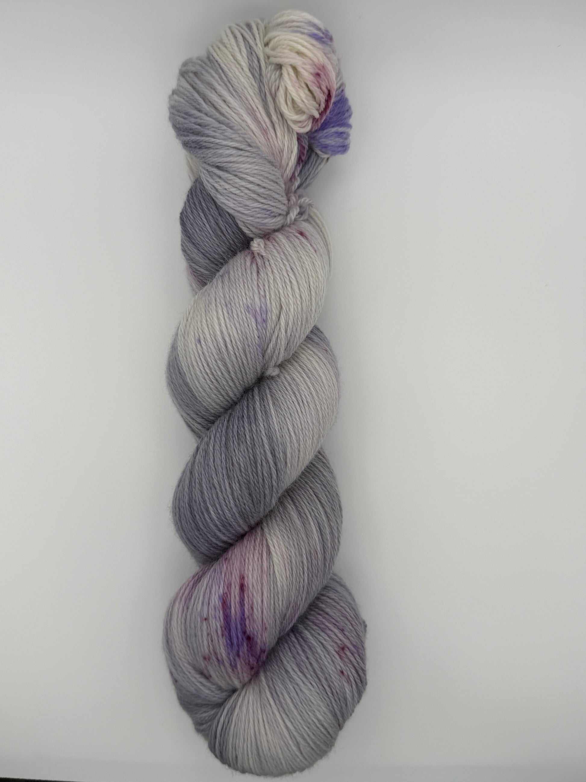 Hand dyed yarn uk, yarn dyed in small batches, geode available in Aran, DK 4 ply, sock, double knit, white, grey, purple tones.