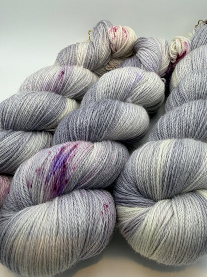 Hand dyed yarn uk, yarn dyed in small batches, geode available in Aran, DK 4 ply, sock, double knit, white, grey, purple tones.