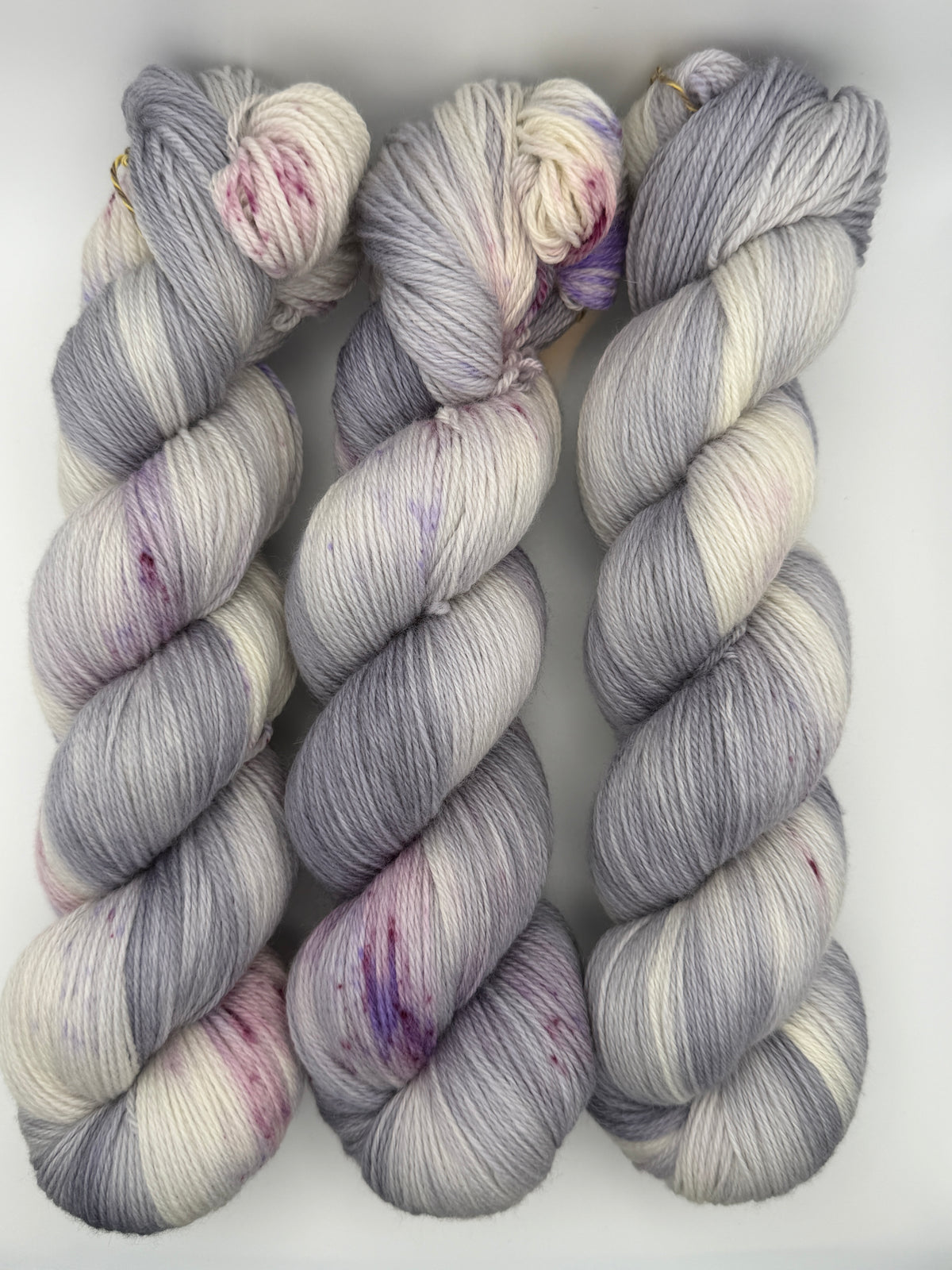 Hand dyed yarn uk, yarn dyed in small batches, geode available in Aran, DK 4 ply, sock, double knit, white, grey, purple tones.