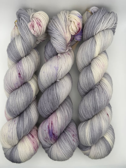 Hand dyed yarn uk, yarn dyed in small batches, geode available in Aran, DK 4 ply, sock, double knit, white, grey, purple tones.