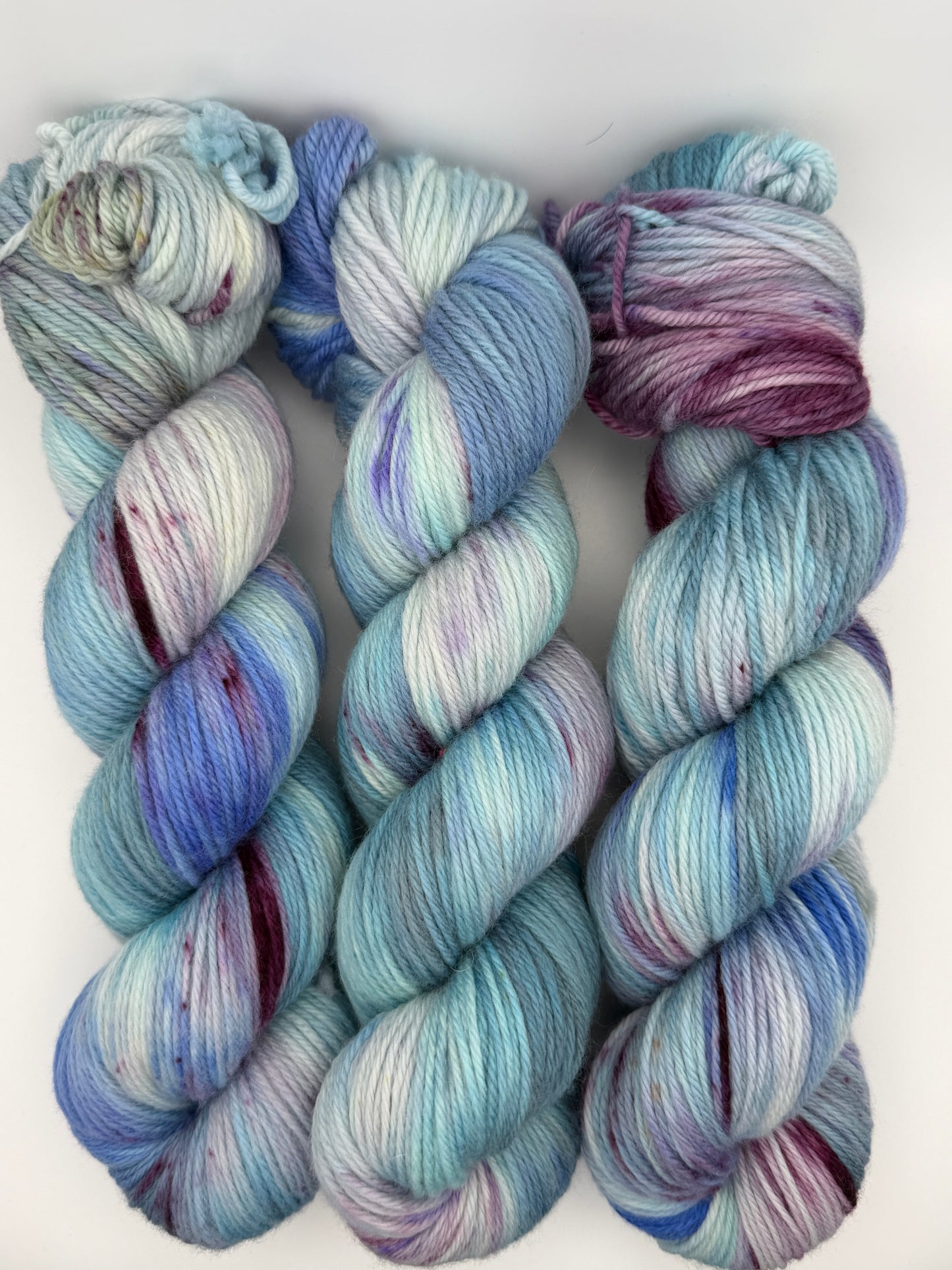 Hand dyed yarn in the UK, available in DK, Double knit, aran, sock, 4ply, fingering weights. Blue and purple tones.
