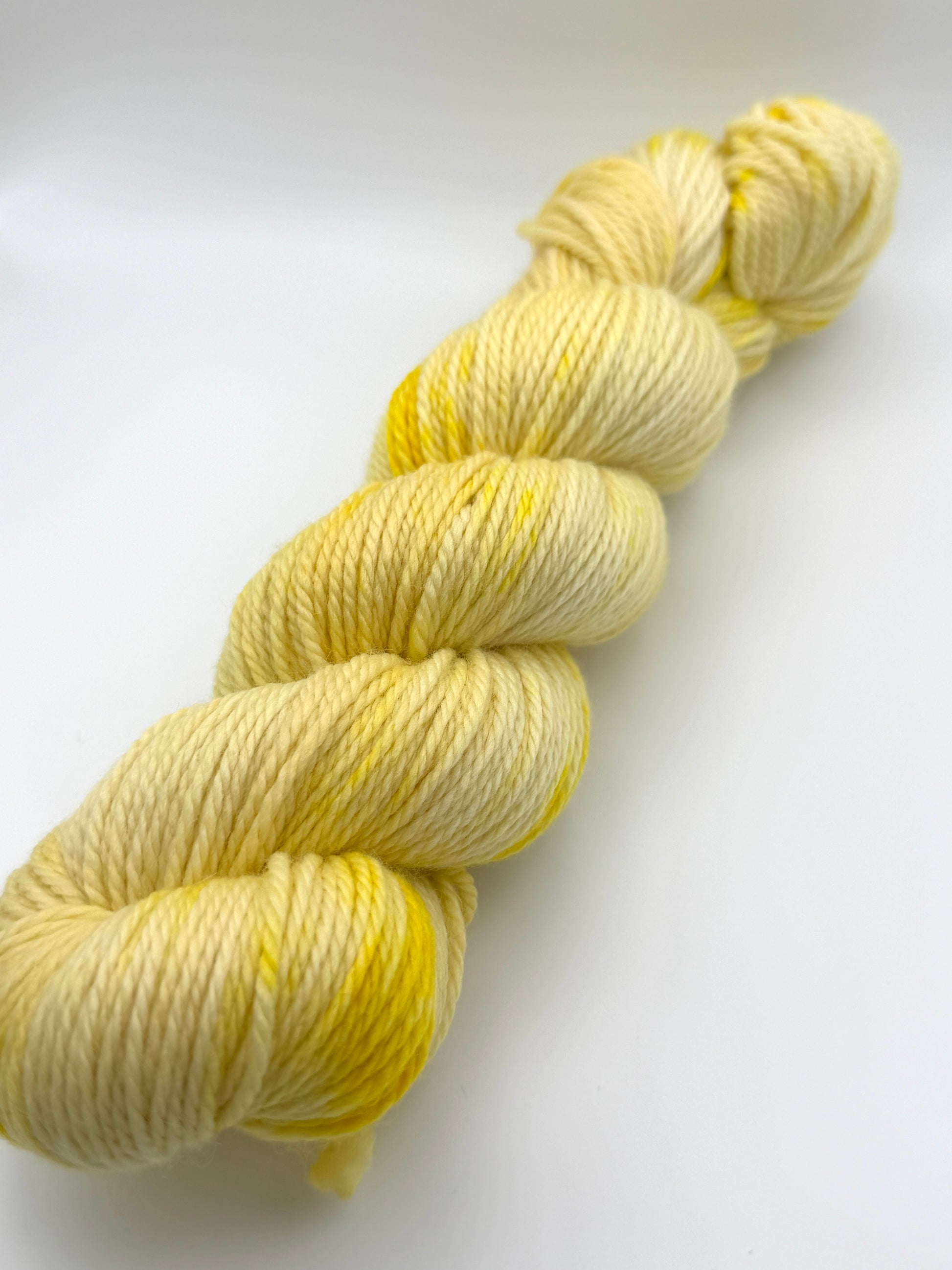 Hand dyed yarn UK available in 4ply sock, aran, DK in Lemon Posset colourway – Lemon, Yellow and Citrus tones.