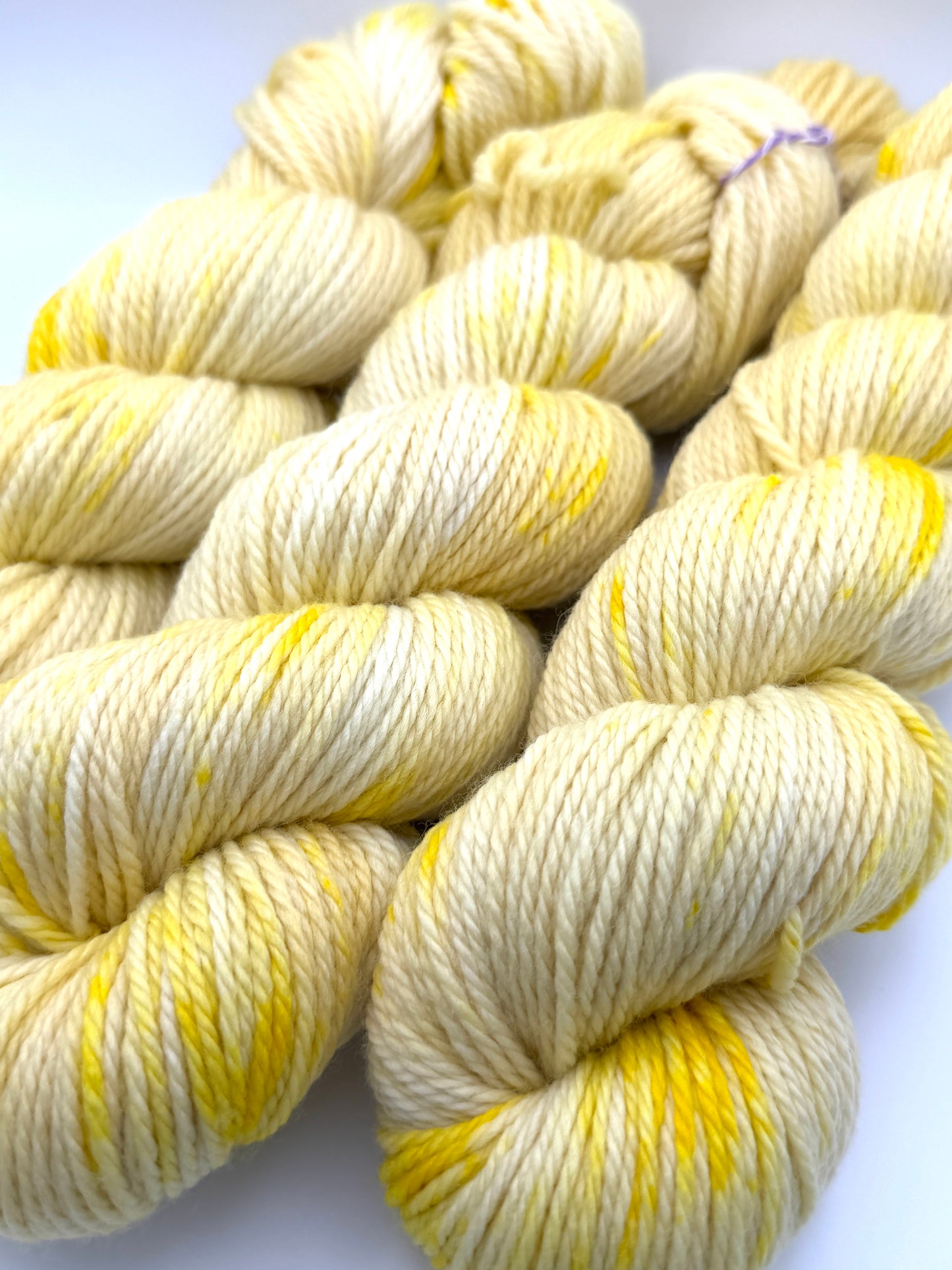 Hand dyed yarn UK available in 4ply sock, aran, DK in Lemon Posset colourway – Lemon, Yellow and Citrus tones.