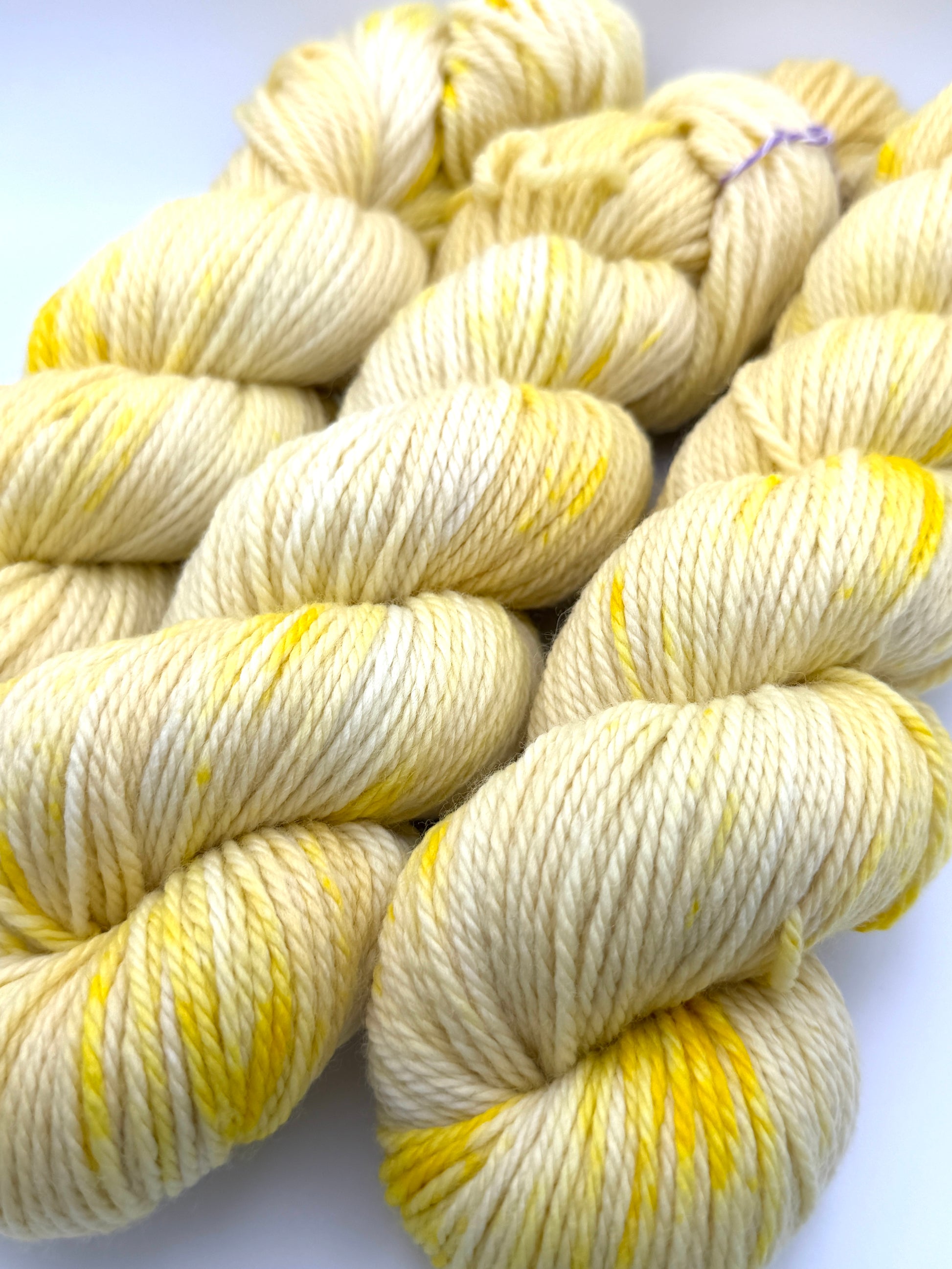 Hand dyed yarn UK available in 4ply sock, aran, DK in Lemon Posset colourway – Lemon, Yellow and Citrus tones.