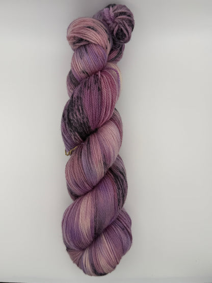 Hand dyed yarn in the UK dyed in small batches. Lilac Skies, purple violet and heather tones.