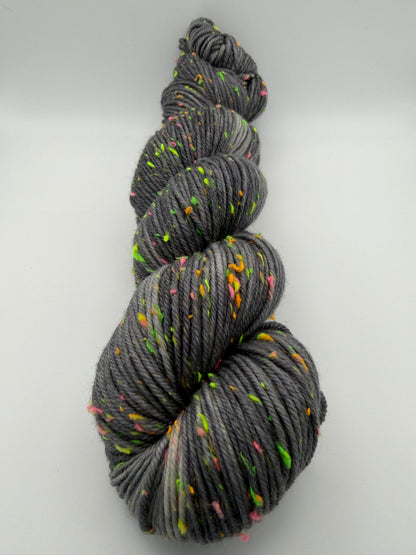 Hand dyed yarn in the UK dyed in small batches. Neon Dust, grey tones with neo nep speckles.
