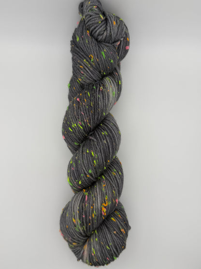 Hand dyed yarn in the UK dyed in small batches. Neon Dust, grey tones with neo nep speckles.