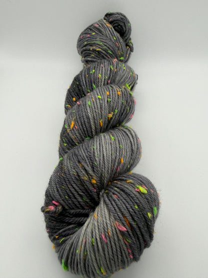 Hand dyed yarn in the UK dyed in small batches. Neon Dust, grey tones with neo nep speckles.