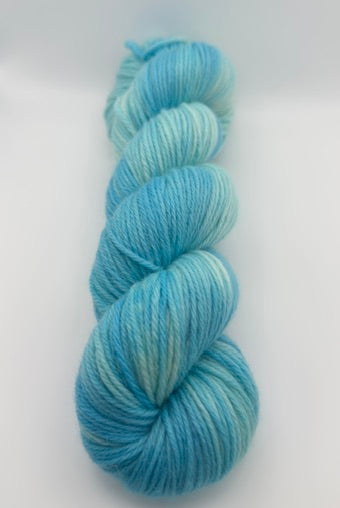 Hand dyed yarn UK available in 4ply sock, aran, DK in Blue Lagoon colourway – blue, teal, aqua tones