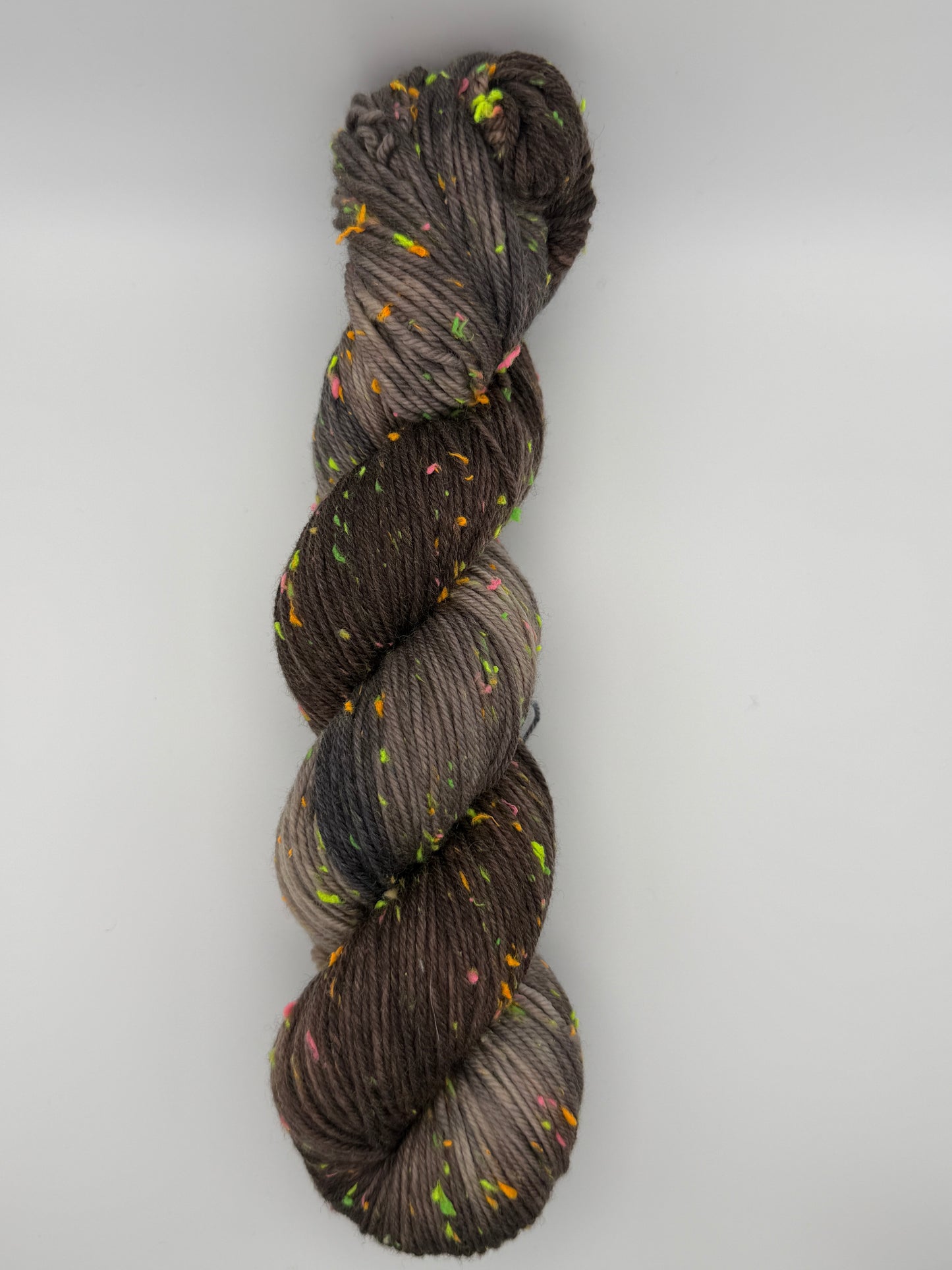 Hand dyed yarn in the UK dyed in small batches. Forest Floor, brown and grey tones with neo nep speckles.