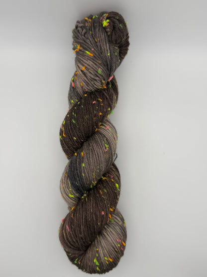 Hand dyed yarn in the UK dyed in small batches. Forest Floor, brown and grey tones with neo nep speckles.