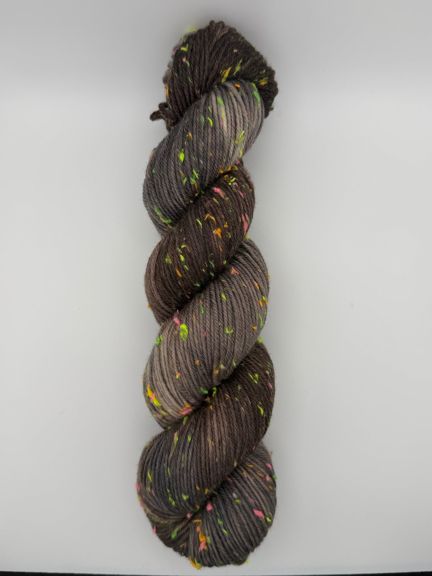 Hand dyed yarn in the UK dyed in small batches. Forest Floor, brown and grey tones with neo nep speckles.