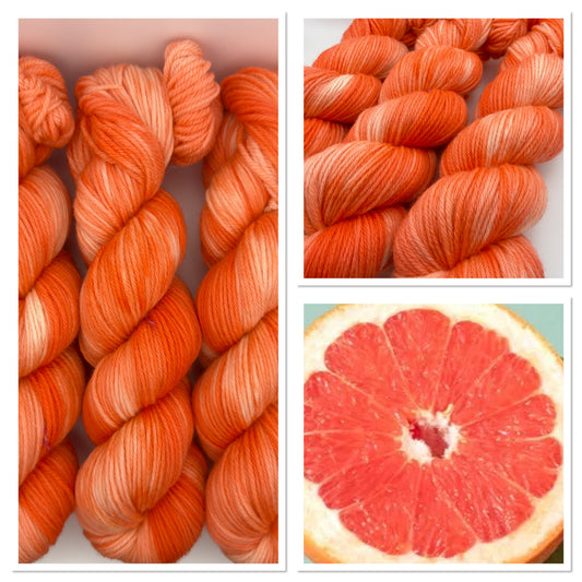 Hand dyed yarn UK available in 4ply sock, aran, DK in Grapefruit Twist colourway – Coral and Citrus tones.