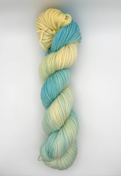 Hand dyed yarn UK available in 4ply sock, aran, DK in Honeydew Sky colourway – Lemon and Blue tones.