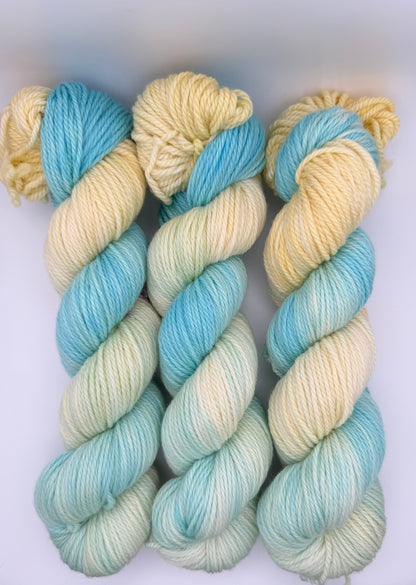 Hand dyed yarn UK available in 4ply sock, aran, DK in Honeydew Sky colourway – Lemon and Blue tones.