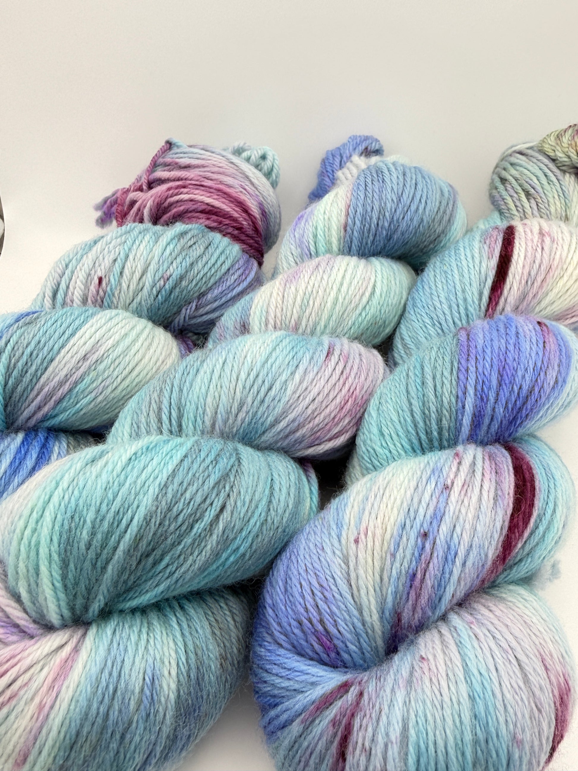 Hand dyed yarn in the UK, available in DK, Double knit, aran, sock, 4ply, fingering weights. Blue and purple tones.