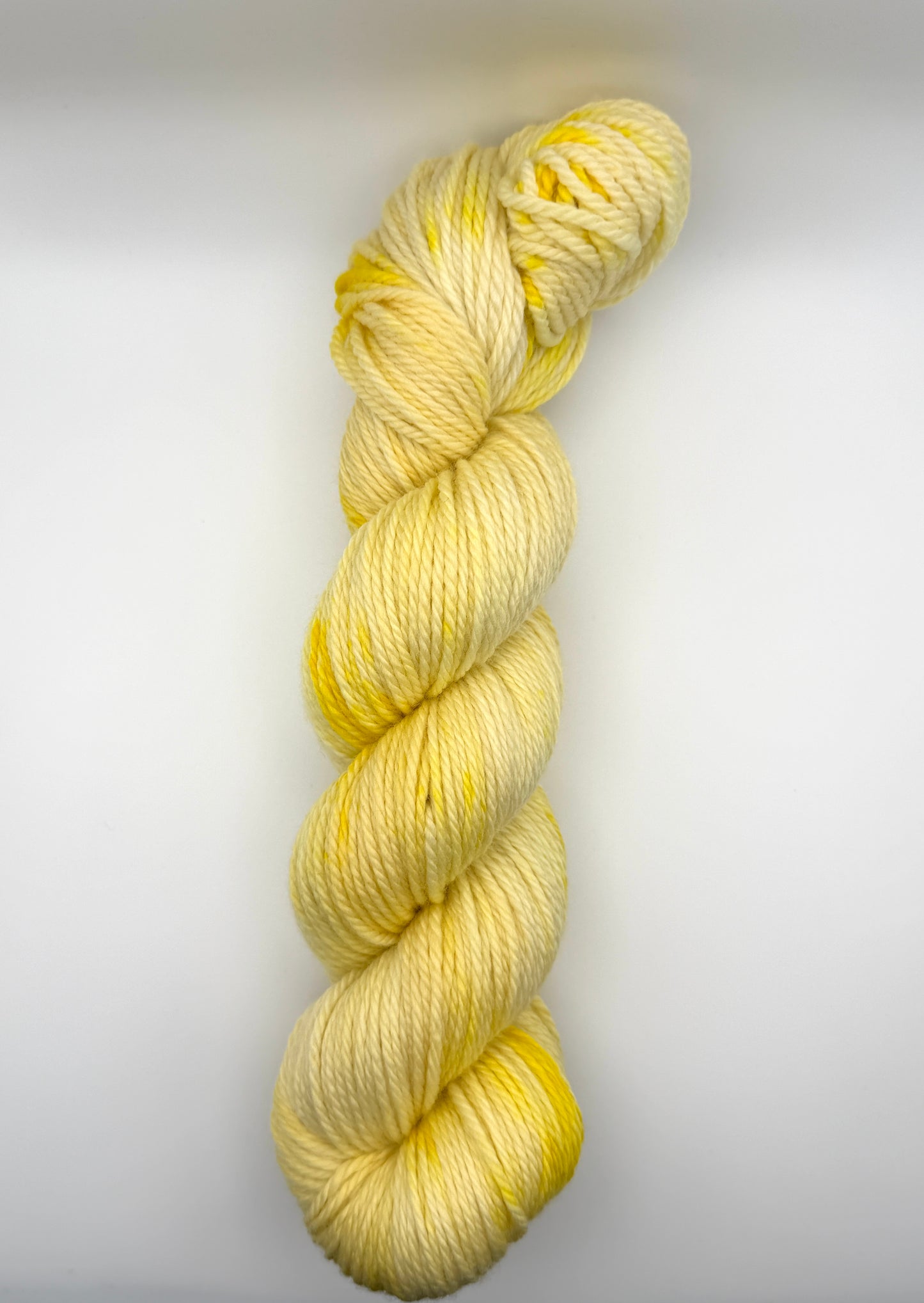 Hand dyed yarn UK available in 4ply sock, aran, DK in Lemon Posset colourway – Lemon, Yellow and Citrus tones.