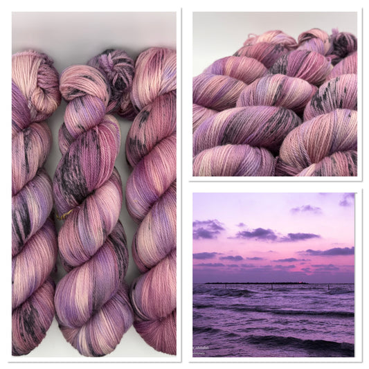 Hand dyed yarn in the UK dyed in small batches. Lilac Skies, purple violet and heather tones.