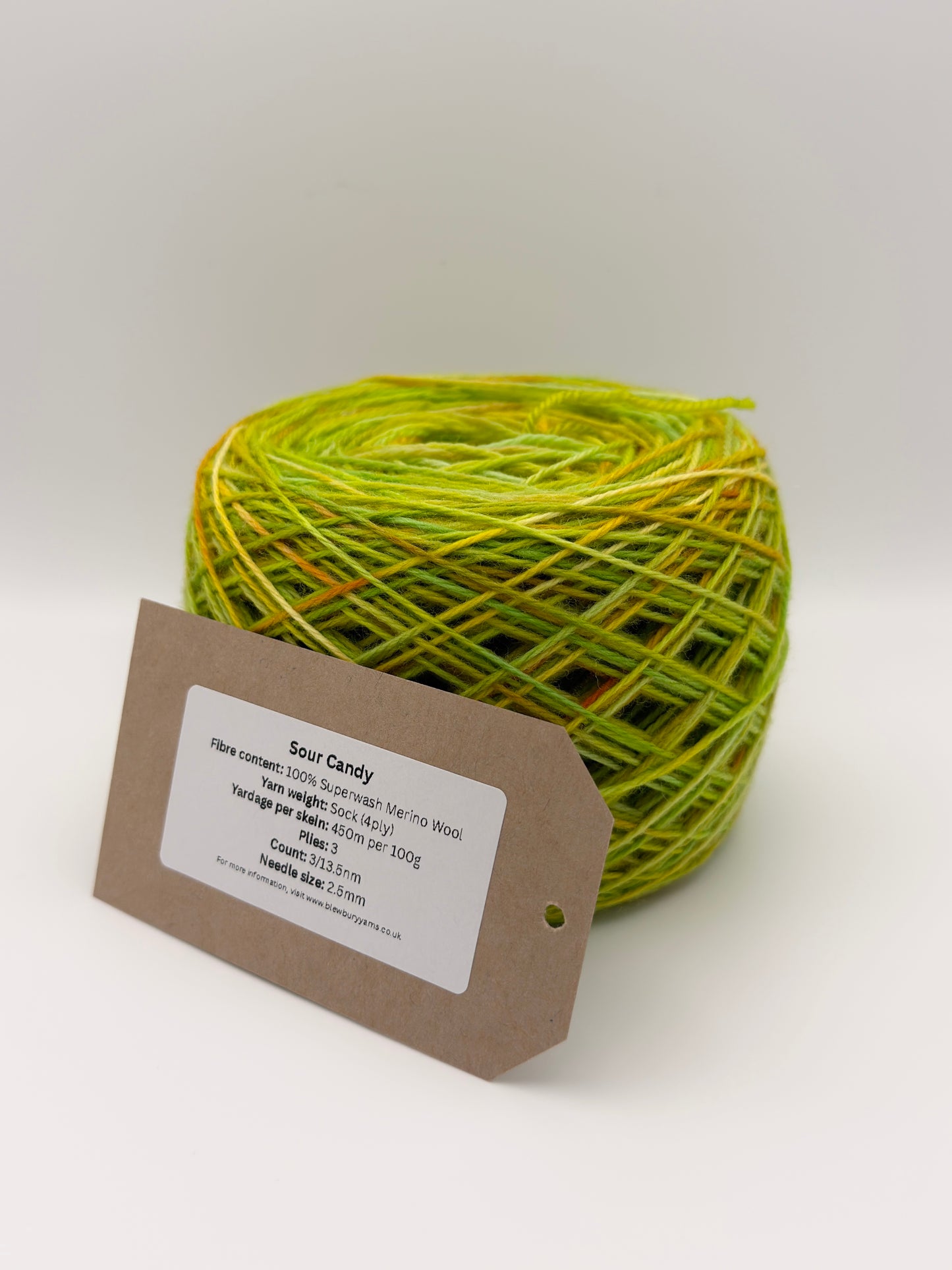 Hand dyed yarn available in 4ply sock, aran, DK in Sour Candy colourway – green and yellow tones with orange speckled yarn