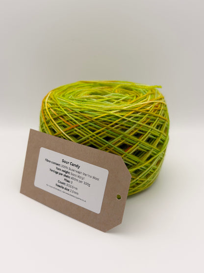 Hand dyed yarn available in 4ply sock, aran, DK in Sour Candy colourway – green and yellow tones with orange speckled yarn