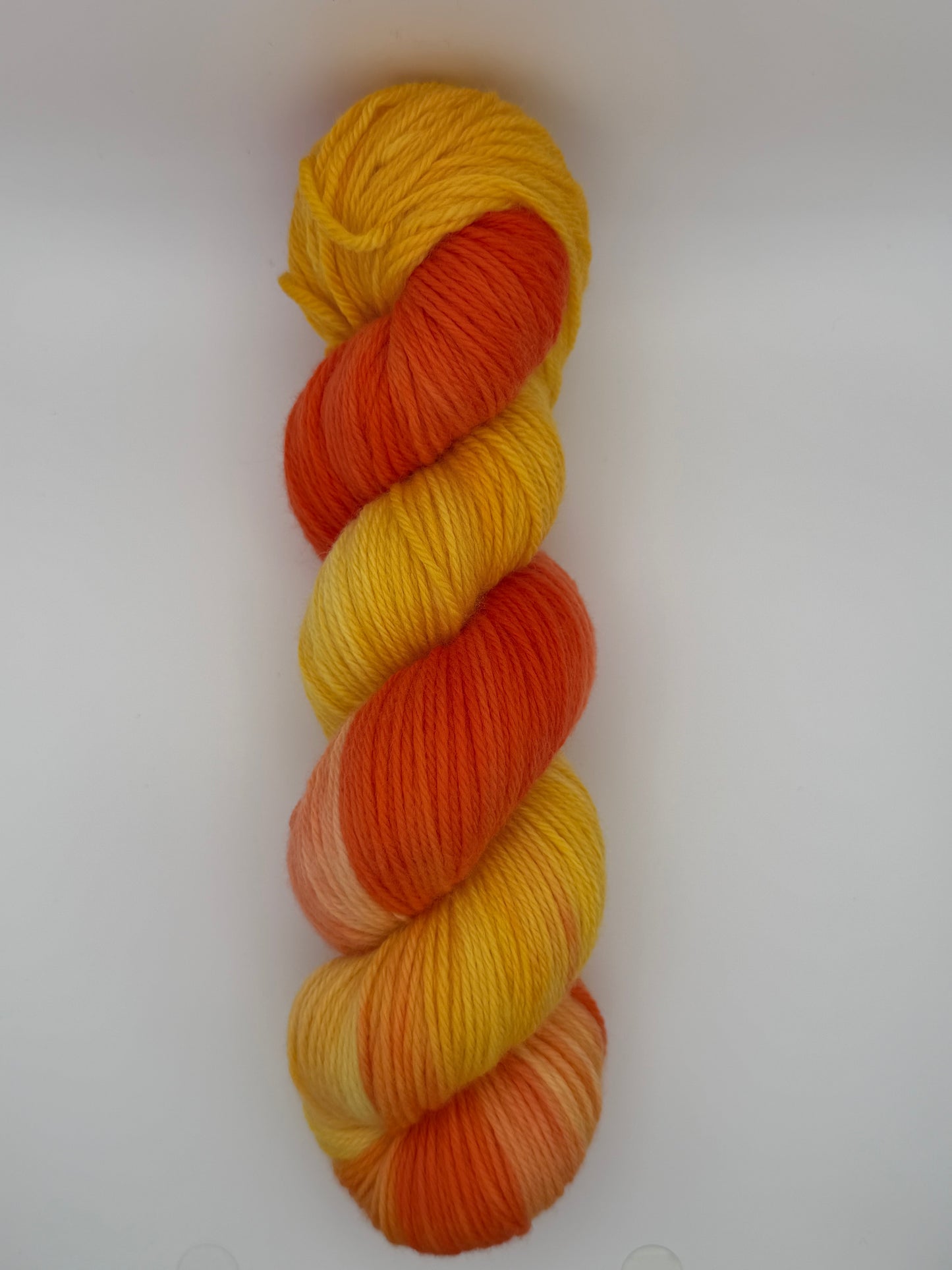 Hand dyed yarn available in 4ply sock, Aran, DK in Tequila Sunrise colourway – orange and yellow tones