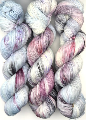 Hand dyed yarn UK available in 4ply sock, aran, DK in Very Berry colourway – blue, purple and neutral tones.